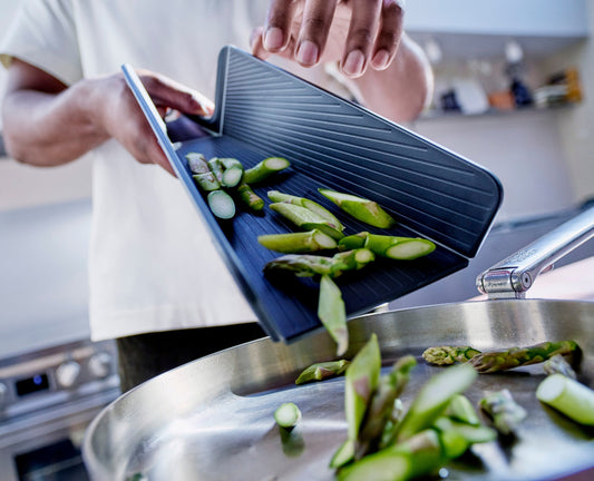 [hidden] [lifestyle] Chop2Pot™ Plus Folding Chopping Board - Black - Image 1