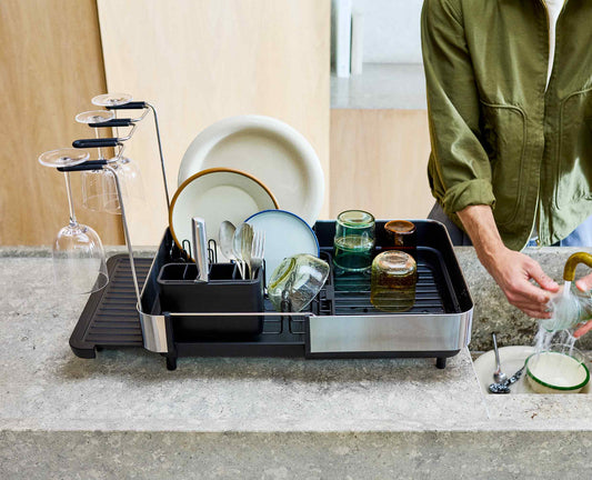 [hidden] [lifestyle] Extend™ Steel Plus Expandable Black Dish Drainer with Wine Glass Rack